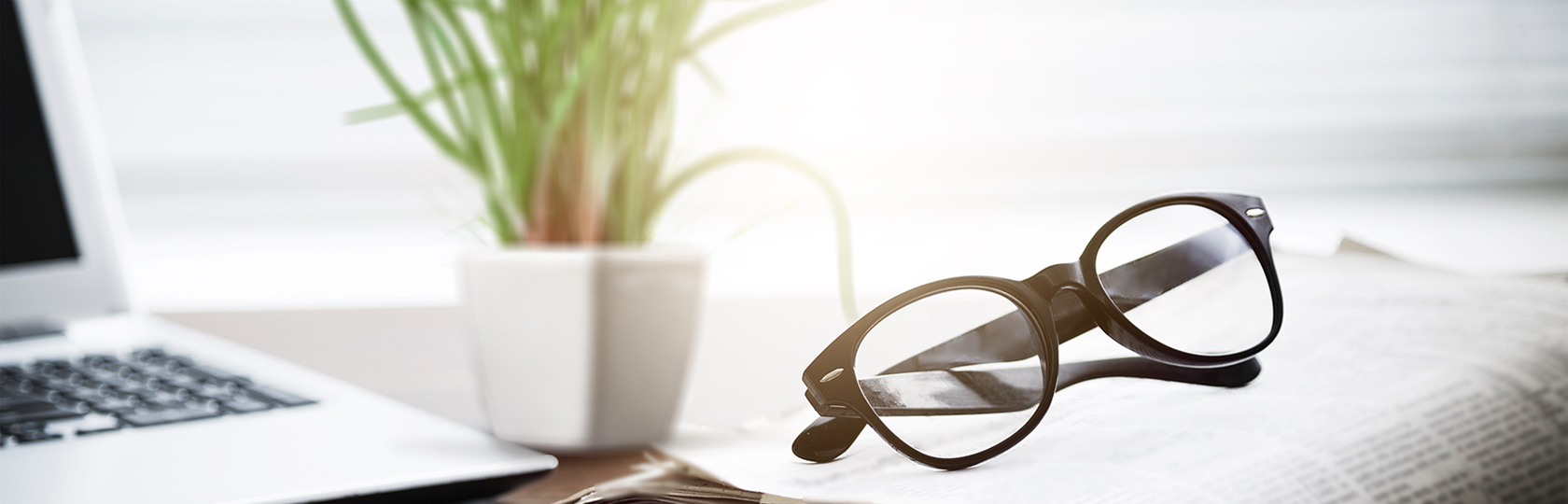 stock photo of glasses on top of a newspaper